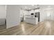 Bright, modern kitchen featuring an island, stainless steel appliances, and wood-look floors at 11842 Sunsail Ave, Orlando, FL 32832
