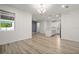 Open floor plan showing the living room, dining area, and kitchen with island and modern appliances at 11842 Sunsail Ave, Orlando, FL 32832