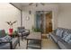 Comfortable outdoor seating on a screened-in patio with a ceiling fan and a view through the sliding doors at 11842 Sunsail Ave, Orlando, FL 32832