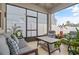 Relaxing screened-in patio with comfortable seating, stylish decor, and lots of light at 11842 Sunsail Ave, Orlando, FL 32832