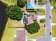 Aerial view of home showcasing solar panels, nice yard, and location on a corner lot at 119 Floral Ct, Kissimmee, FL 34743