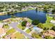 Aerial view of a lovely home on a large lake and beautiful neighborhood at 119 Floral Ct, Kissimmee, FL 34743