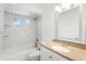 Bathroom with a shower-tub combo with decorative tile and a vanity at 119 Floral Ct, Kissimmee, FL 34743