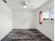 Bedroom featuring laminate flooring, a ceiling fan, a window, and neutral wall colors at 119 Floral Ct, Kissimmee, FL 34743