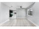 Bright dining room area with ceiling fan adjacent to the kitchen, featuring tile flooring and neutral paint at 119 Floral Ct, Kissimmee, FL 34743