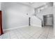 Expansive living room offering high ceilings, tile floors, and abundant natural light through large windows at 119 Floral Ct, Kissimmee, FL 34743