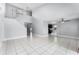 Bright living room with high ceilings, neutral paint, and ample natural light from the open floor plan at 119 Floral Ct, Kissimmee, FL 34743