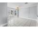 Open living room featuring tile flooring, a bay window, and neutral wall colors at 119 Floral Ct, Kissimmee, FL 34743