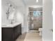 Bathroom with a large vanity and a walk-in shower with glass doors at 1221 Thunder Trl, Maitland, FL 32751