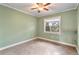 Bedroom with vintage ceiling fan, neutral tile flooring and light green painted walls at 1221 Thunder Trl, Maitland, FL 32751