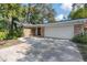 Charming single-story home featuring brick accents, mature landscaping, and a spacious two-car garage at 1221 Thunder Trl, Maitland, FL 32751