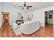 Cozy living room with wood flooring, access to the backyard, and neutral-toned furniture for relaxation and comfort at 1221 Thunder Trl, Maitland, FL 32751