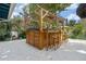 Wooden outdoor bar structure featuring bar seating, wooden accents, and a covered pergola at 1221 Thunder Trl, Maitland, FL 32751