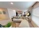 Living room with sectional sofa and view into kitchen and dining area at 125 Waldor Ave, Orange City, FL 32763