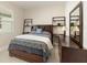 Inviting bedroom with a wooden bed frame, decorative shelves, and lots of natural light at 13557 Parkfield Way, Winter Garden, FL 34787