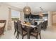 Elegant dining room with stylish light fixture open to a modern kitchen, perfect for entertaining guests at 13557 Parkfield Way, Winter Garden, FL 34787