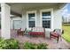 Inviting covered front porch with comfortable seating and views of the manicured lawn at 13557 Parkfield Way, Winter Garden, FL 34787