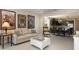 Spacious living room flowing into an open-concept dining area and kitchen, creating a welcoming and modern living space at 13557 Parkfield Way, Winter Garden, FL 34787