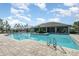 Community pool area with a zero entry access and lounge seating at 13557 Parkfield Way, Winter Garden, FL 34787