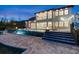 Backyard oasis featuring a stunning pool with a waterfall feature and fire bowls at 15138 Shonan Gold Dr, Winter Garden, FL 34787