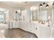 Bright bathroom showcasing a white double vanity and modern sinks at 15138 Shonan Gold Dr, Winter Garden, FL 34787