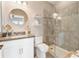 Modern bathroom with a glass-enclosed shower, vanity, and fixtures offering a sleek and functional space at 15138 Shonan Gold Dr, Winter Garden, FL 34787