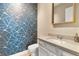 Stylish powder room showcases geometric wallpaper and a modern vanity at 15138 Shonan Gold Dr, Winter Garden, FL 34787