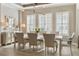 Formal dining room with stylish lighting, elegant decor, and ample seating for gatherings at 15138 Shonan Gold Dr, Winter Garden, FL 34787