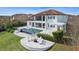 Spacious backyard with a pool, fire pit, and pergola, perfect for outdoor entertaining at 15138 Shonan Gold Dr, Winter Garden, FL 34787