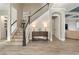 Welcoming foyer with staircase, stylish decor, and views into the living areas at 15138 Shonan Gold Dr, Winter Garden, FL 34787
