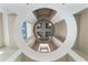 Elegant foyer with a decorative ceiling, modern light fixture, and natural light at 15138 Shonan Gold Dr, Winter Garden, FL 34787