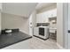 Functional laundry room with modern washer, dryer, and ample counter space at 15138 Shonan Gold Dr, Winter Garden, FL 34787