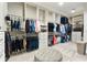 Large walk-in closet featuring ample hanging space and custom shelving at 15138 Shonan Gold Dr, Winter Garden, FL 34787