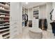 Spacious walk-in closet featuring custom shelving, drawers and ample storage at 15138 Shonan Gold Dr, Winter Garden, FL 34787
