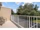 Balcony overlooks lush trees and provides a relaxing view at 1534 Tranquil Ave, Clermont, FL 34714