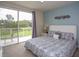 Main bedroom with private balcony and king-size bed at 1534 Tranquil Ave, Clermont, FL 34714