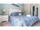 Bedroom with a king-size bed and blue walls at 1534 Tranquil Ave, Clermont, FL 34714