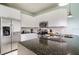 Modern kitchen with stainless steel appliances and granite countertops at 1534 Tranquil Ave, Clermont, FL 34714