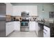 Modern kitchen with stainless steel appliances and granite countertops at 1534 Tranquil Ave, Clermont, FL 34714