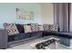 Living room with sectional sofa and glass coffee table at 1534 Tranquil Ave, Clermont, FL 34714