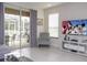 Bright living room with patio access, large TV, and comfortable seating at 1534 Tranquil Ave, Clermont, FL 34714