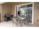 Patio with seating area and grill, sliders to interior at 1534 Tranquil Ave, Clermont, FL 34714