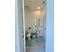 Half-bathroom features tiled floors, pedestal sink, and neutral walls at 1700 Tropical Palms Cir, Kissimmee, FL 34747