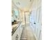 Bathroom with granite countertops, glass shower doors, white vanity and tile flooring at 1700 Tropical Palms Cir, Kissimmee, FL 34747