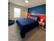 Bright bedroom with colorful wall accents and soft carpet creating a cozy space at 1700 Tropical Palms Cir, Kissimmee, FL 34747