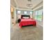 Comfortable primary bedroom with an elegant tray ceiling, ample natural light, and plush carpet at 1700 Tropical Palms Cir, Kissimmee, FL 34747
