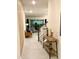 Inviting hallway with view into the living area and stairs leading to upper level at 1700 Tropical Palms Cir, Kissimmee, FL 34747