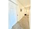 Hallway with carpeted flooring, doors and neutral walls and décor at 1700 Tropical Palms Cir, Kissimmee, FL 34747