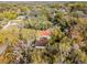 Expansive aerial view showing the property nestled among lush trees in a beautiful neighborhood at 2004 Magnolia Ave, Sanford, FL 32771