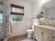 Well-lit bathroom with a vanity, tiled walls, and a glass-enclosed shower at 2004 Magnolia Ave, Sanford, FL 32771
